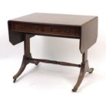 Regency design mahogany drop end sofa table with brass paw feet, 73.5cm H x 86cm W x 62.5cm D when