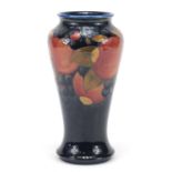 William Moorcroft pottery baluster vase hand painted in the Pomegranate pattern, 23cm high :