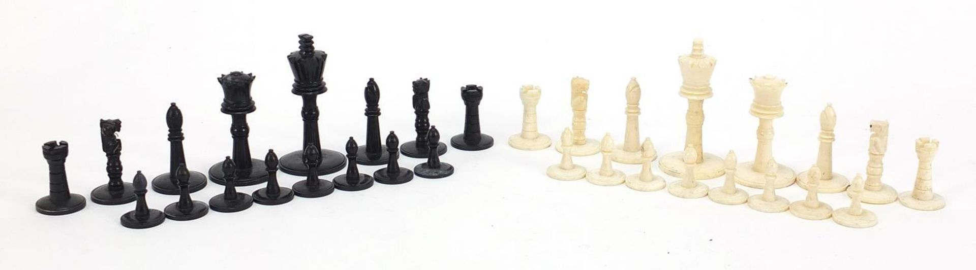 Carved bone half stained chess set, the largest pieces each 5.5cm high :