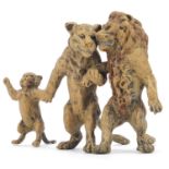 Cold painted bronze group of a lion, lioness and cub in the style of Franz Xaver Bergmann, 8.5cm