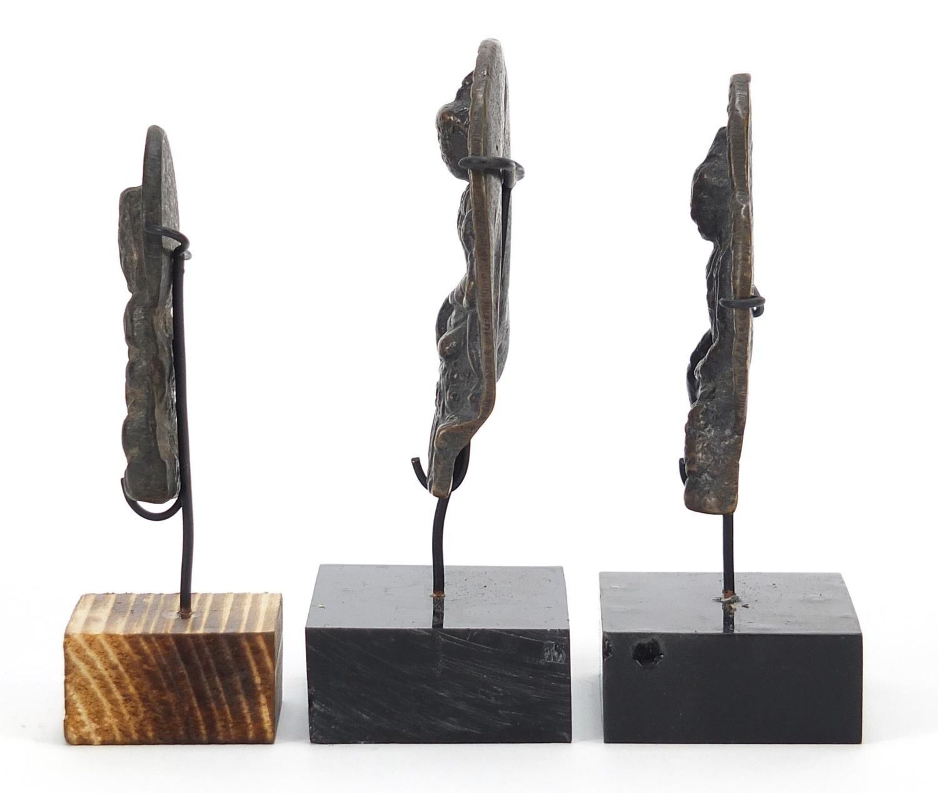 Three Nepalese patinated bronze plaques of Buddha with display stands, the largest 11cm high : - Image 5 of 10