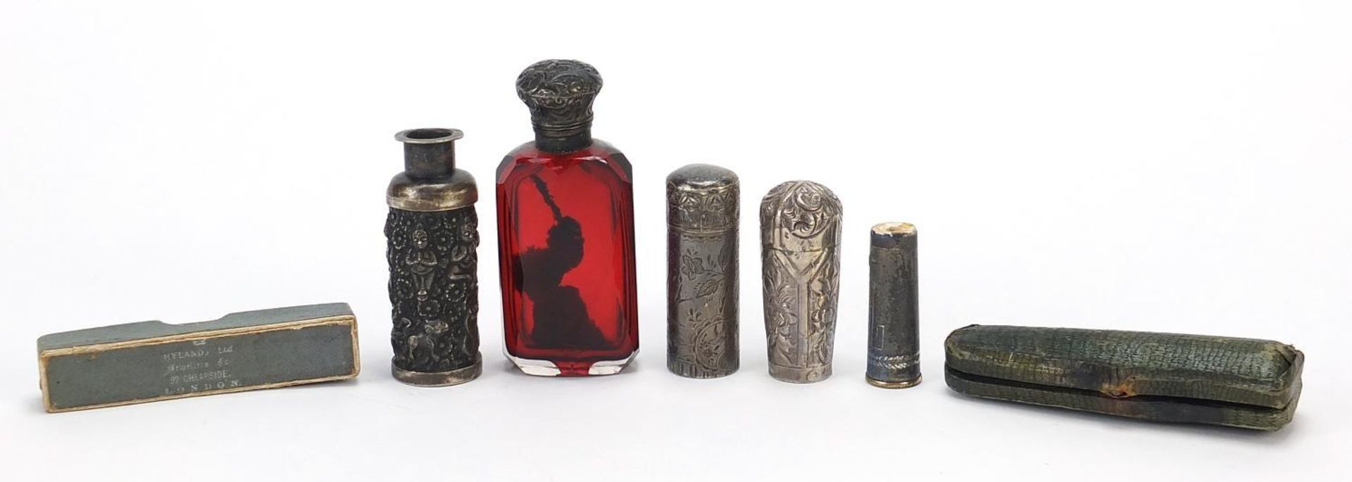 Antique and later silver objects including a Victorian ruby glass scent bottle with silver lid,