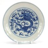 Chinese blue and white porcelain dish hand painted with dragons amongst clouds chasing a flaming