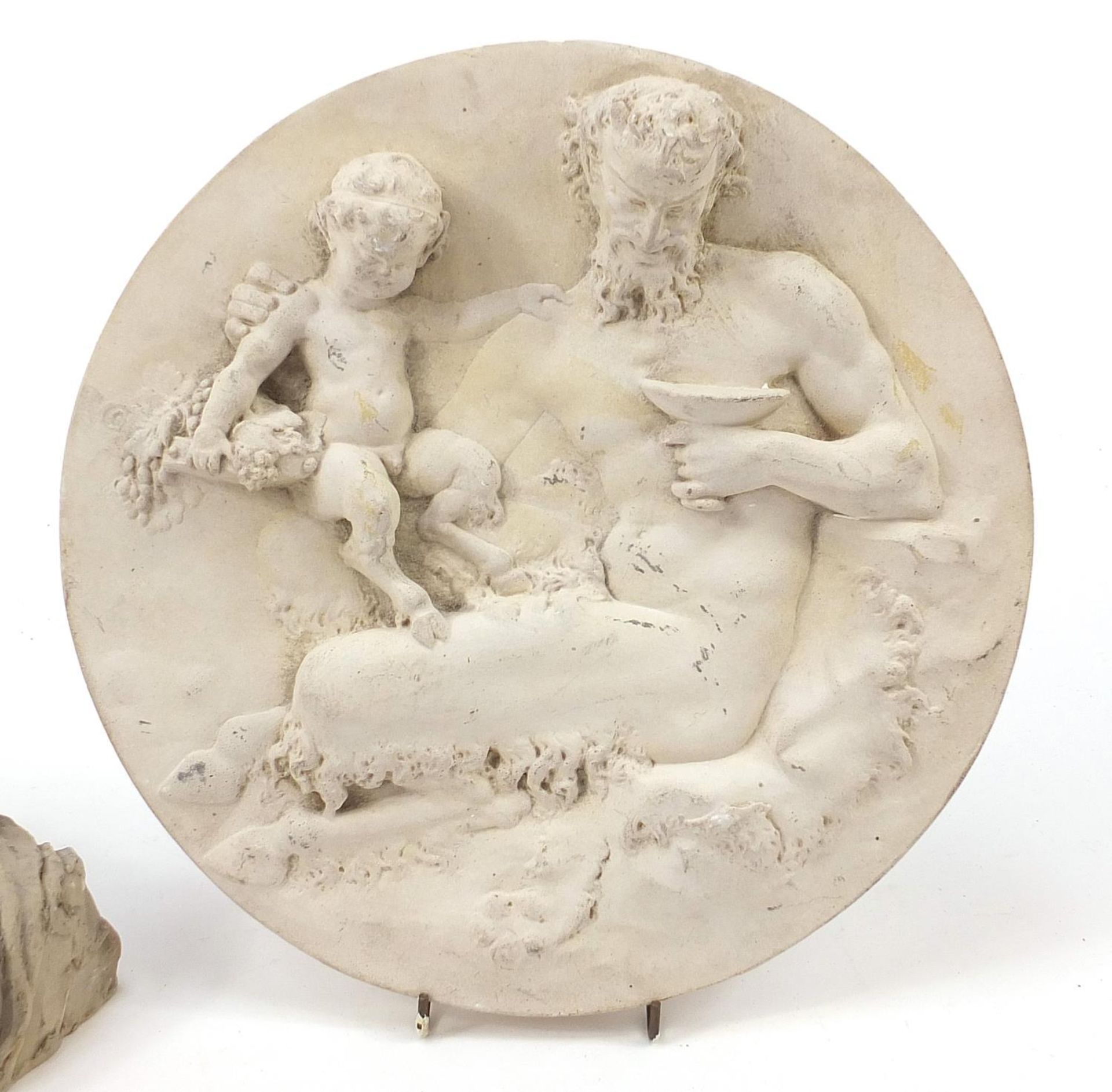 Modernist sculpture of a reclining nude female and a plaster roundel of a faun, the largest 29cm - Image 3 of 5