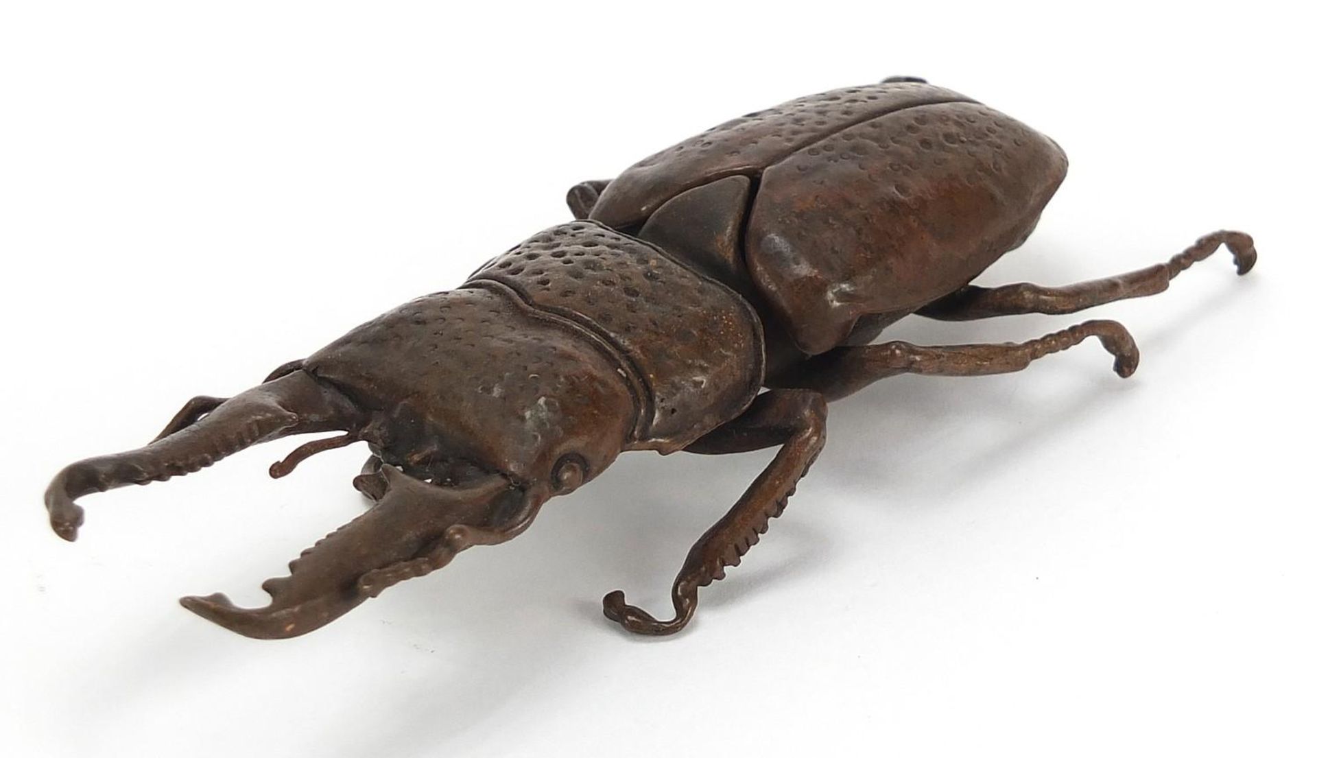 Large Japanese patinated bronze beetle with articulated back, impressed marks to the underside, 13.