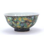 Chinese porcelain footed bowl hand painted in the famille noir palette with butterflies amongst