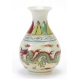 Chinese porcelain vase decorated in the wucai palette with two dragons amongst clouds, six figure