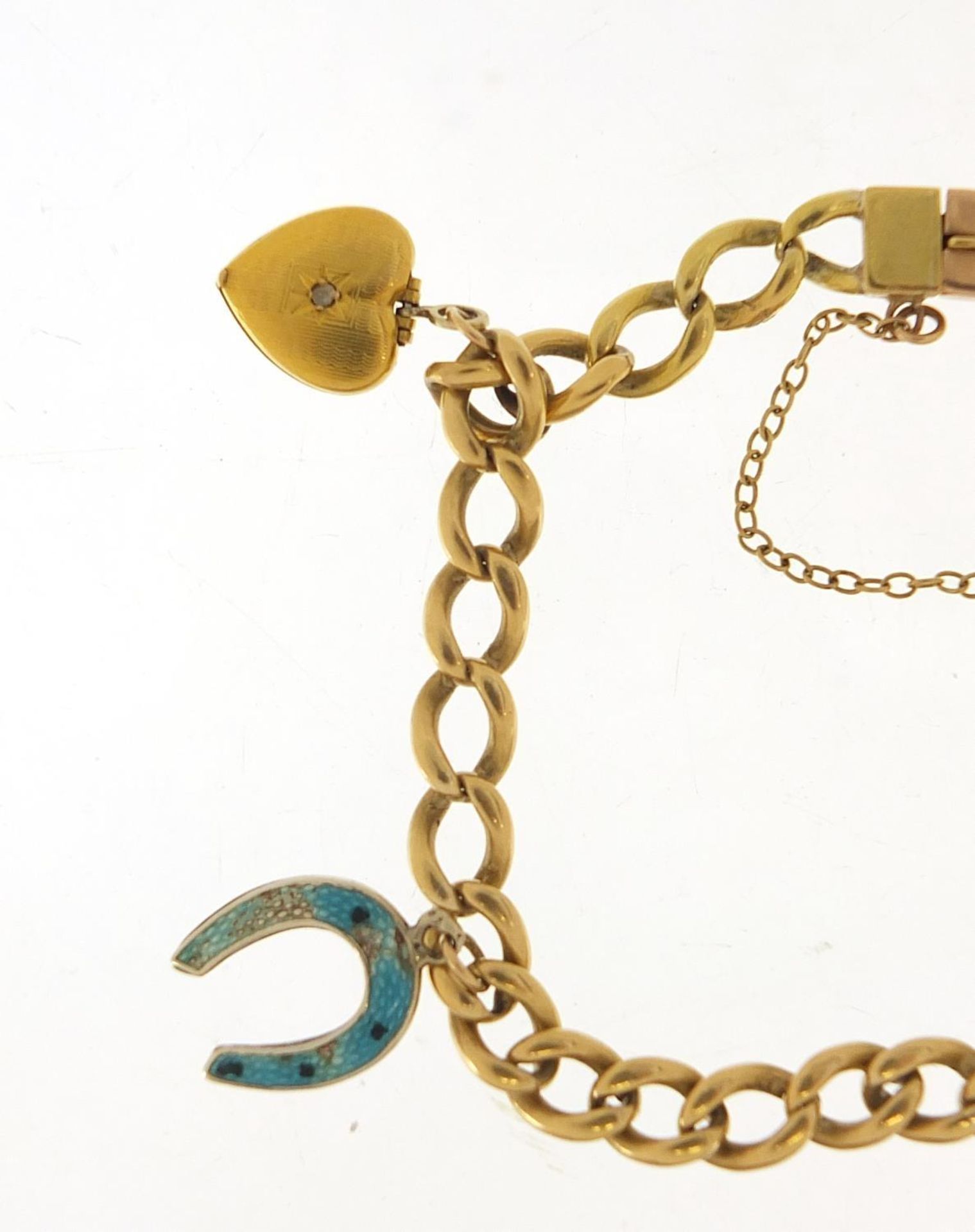 Unmarked gold bracelet with gold and silver charms, the bracelet tests as 18ct gold, total 23.0g : - Image 2 of 6