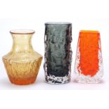 Geoffrey Baxter for Whitefriars, three glass vases including a tangerine coffin vase, the largest