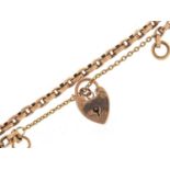 Unmarked gold bracelet, (tests as 9ct gold) with a 9ct gold loveheart padlock, 16cm in length, 7.