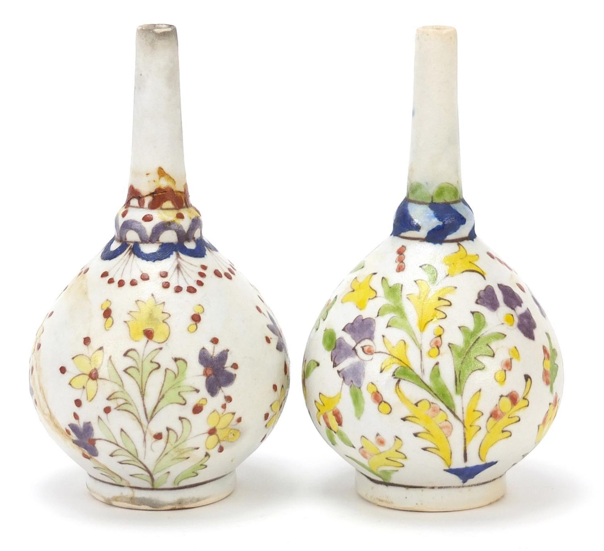 Pair of Islamic rosewater sprinklers hand painted with flowers, each 15.5cm high :