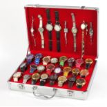 Thirty two ladies' and gentlemen's dress wristwatches including Henley, Geneva and Accurist housed