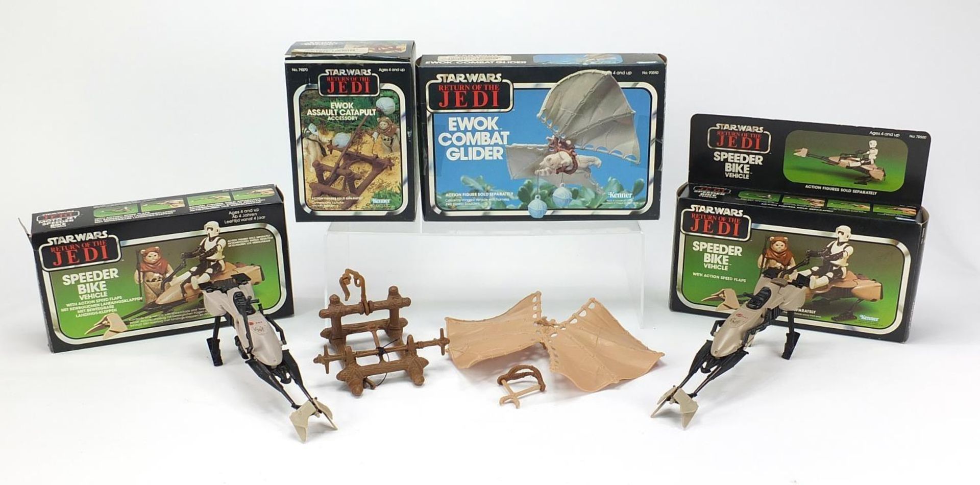 Four Vintage Star Wars Return of the Jedi toys comprising Ewok Combat Glider, Ewok Assault