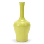 Chinese porcelain vase having a yellow glaze, six figure character marks to the base, 24cm high :