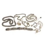 Silver and white metal jewellery including necklaces, watch chain, bracelets and a brooch, 142.0g :