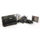 Sega Mega Drive games console with Mega-CD converter and controllers :