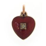 Antique unmarked gold and enamel love heart charm, set with a seed pearl, 1.2cm high, 0.8g :