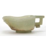 Chinese celadon jade libation cup carved with water dragons, 10.5cm in length :