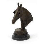 Patinated bronze horse head raised on a circular marble base, 29cm high :
