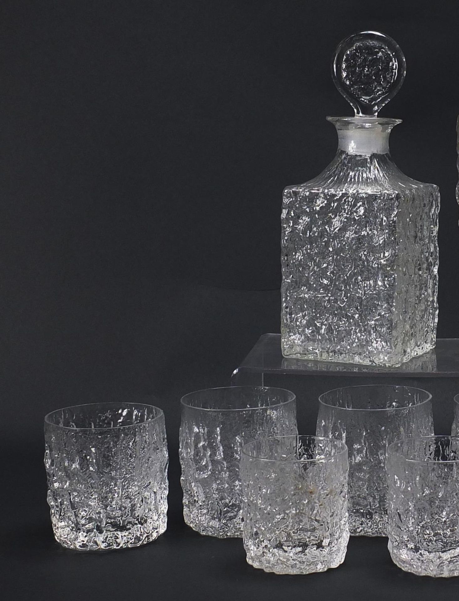 Geoffrey Baxter for Whitefriars, textured glassware comprising two decanters, set of six tumbles and - Image 2 of 4