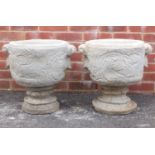 Pair of stoneware garden planters decorated with wild animals and birds amongst vines, 45cm high :