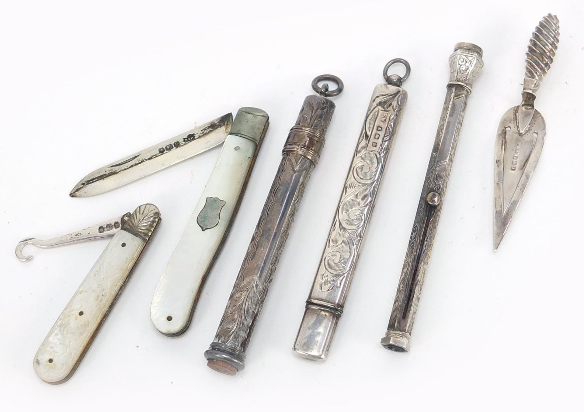 Antique and later silver objects comprising two propelling pencils, a pencil case, mother of pearl