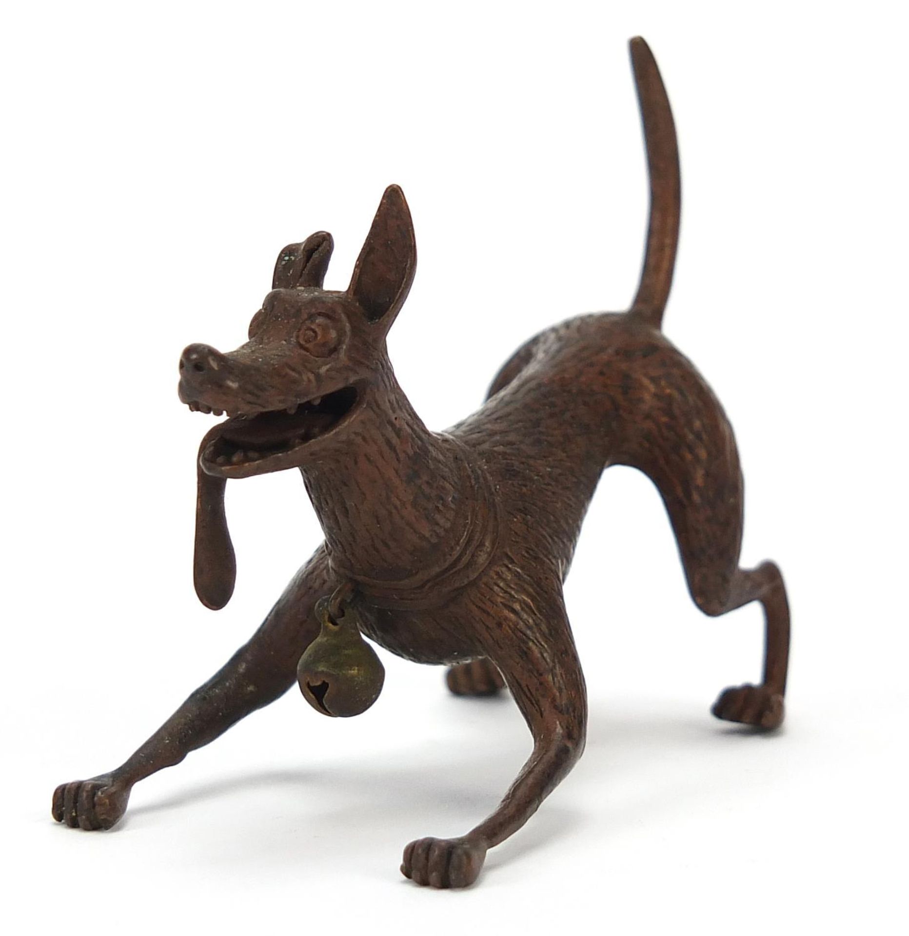 Japanese patinated bronze dog, character marks to the underside, 6cm in length :