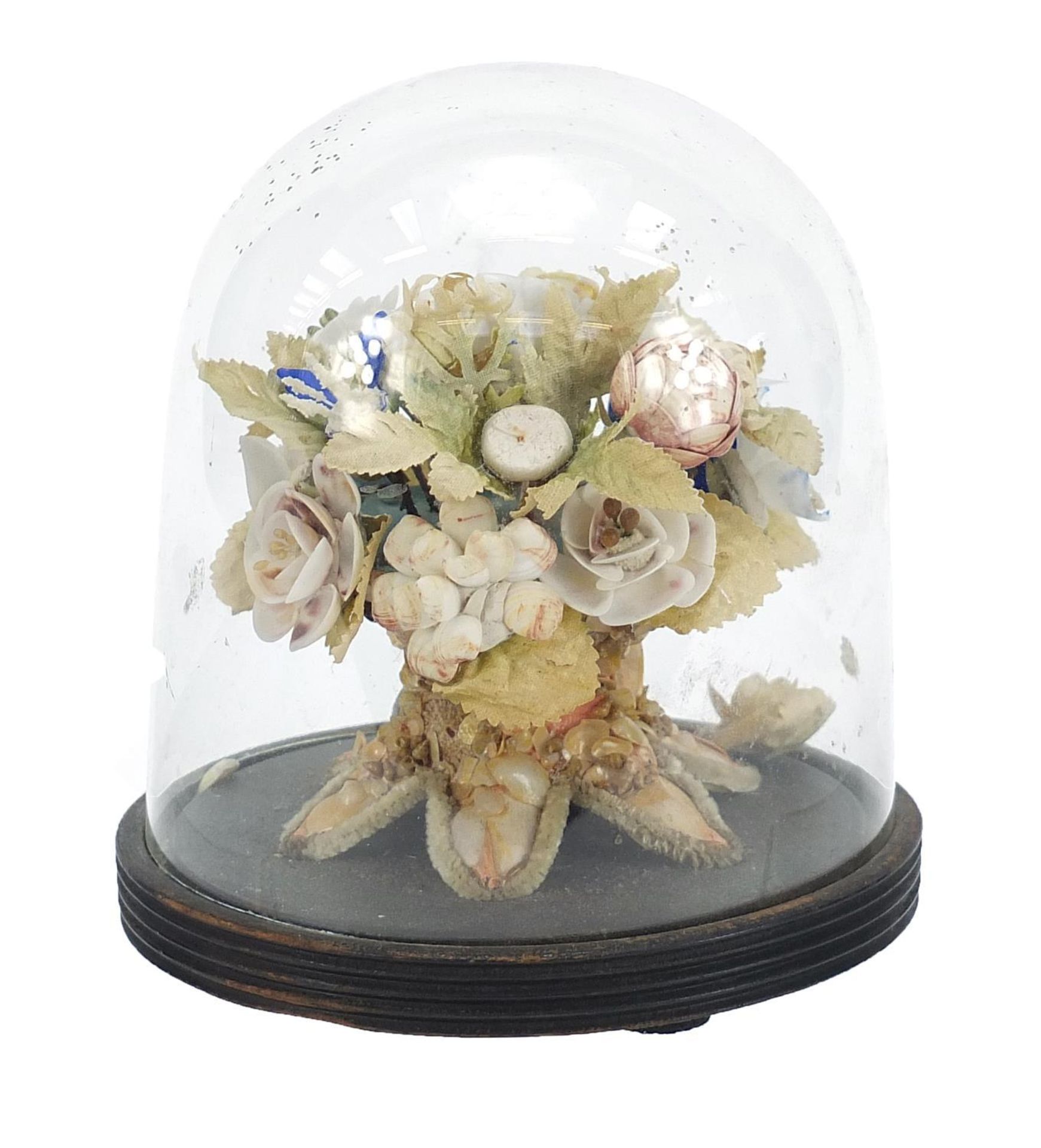 Naval interest sailor's shellwork floral bouquet housed under a glass dome with ebonised base,