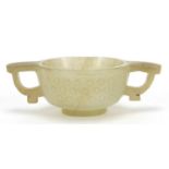 Good Chinese carved celadon jade libation cup with twin handles, 9cm wide :