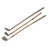 Three wooden shafted golf clubs including aluminum putter, Spalding and Vee putter :