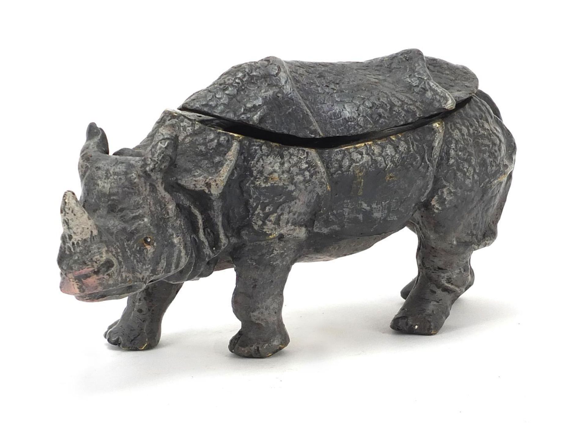 Cold painted bronze double inkwell in the form of a rhinoceros, 16cm wide :