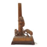 German prisoner of war carved wood lampstand in the form of a goat beside a boy climbing a tree