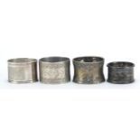 Four silver coloured metal napkin rings including one Russian silver and one sterling silver,