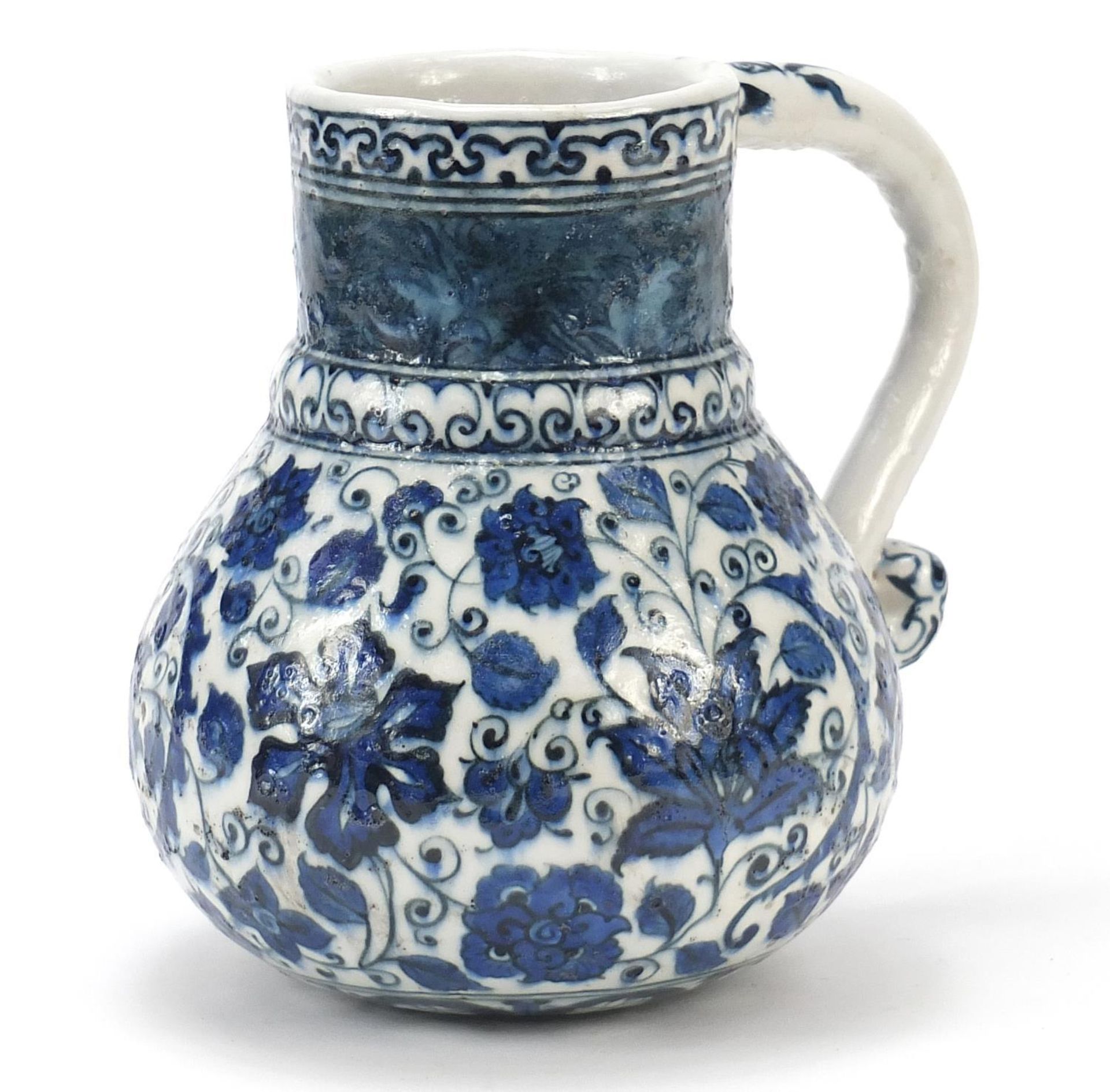 Turkish Iznik water jug with handle, hand painted with flowers and foliage, 19.5cm high :