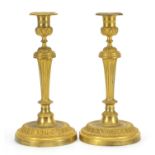 Pair of Antique French Louis XVI style ormolu candlesticks, each 28cm high :