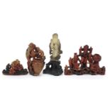 Chinese soapstone carvings including Shao Lou holding a peach and a monkey vase with character