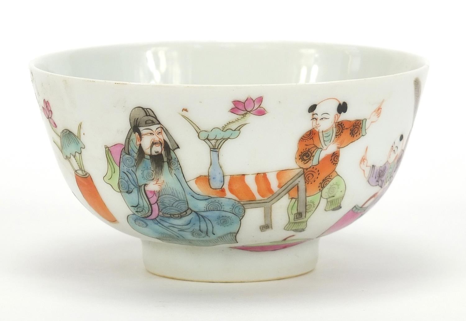 Chinese porcelain bowl hand painted in the famille rose palette with figures in a palace setting,