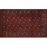 Rectangular Persian rug having a traditional repeat medallion, 200cm x 125cm :For Further