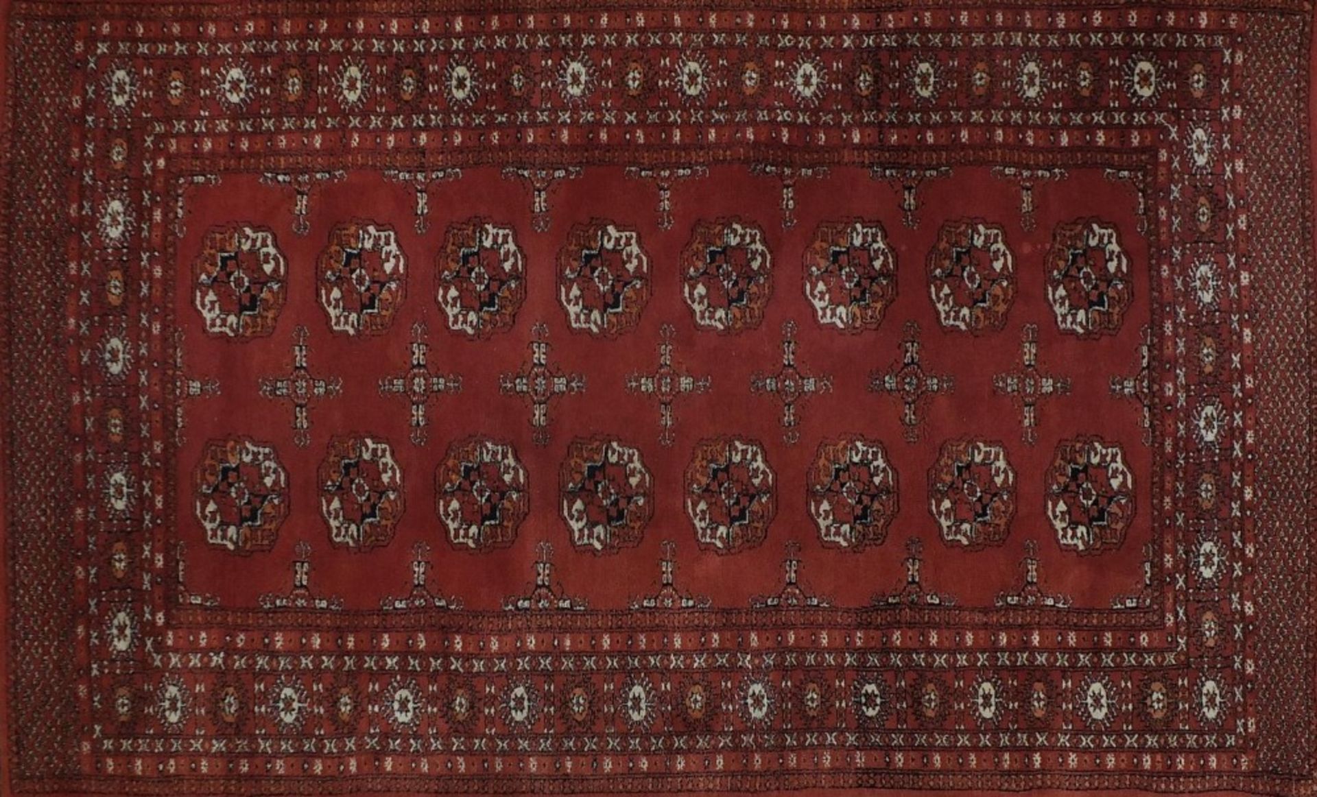 Rectangular Persian rug having a traditional repeat medallion, 200cm x 125cm :For Further