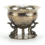 Josiah Williams & Co, Arts & Crafts silver table salt with planished body and three dolphin