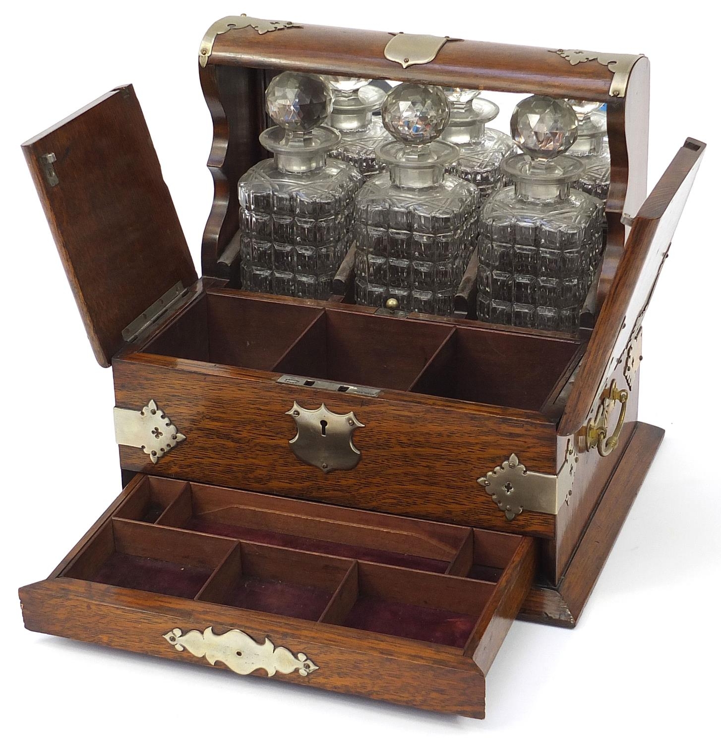 Victorian oak tantalus compendium with metal mounts and carrying handles fitted with three glass - Image 2 of 7