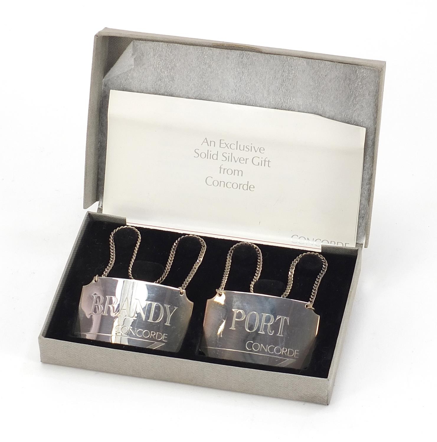British Airways, pair of silver Concorde decanter labels with box, comprising port and brandy, 5cm