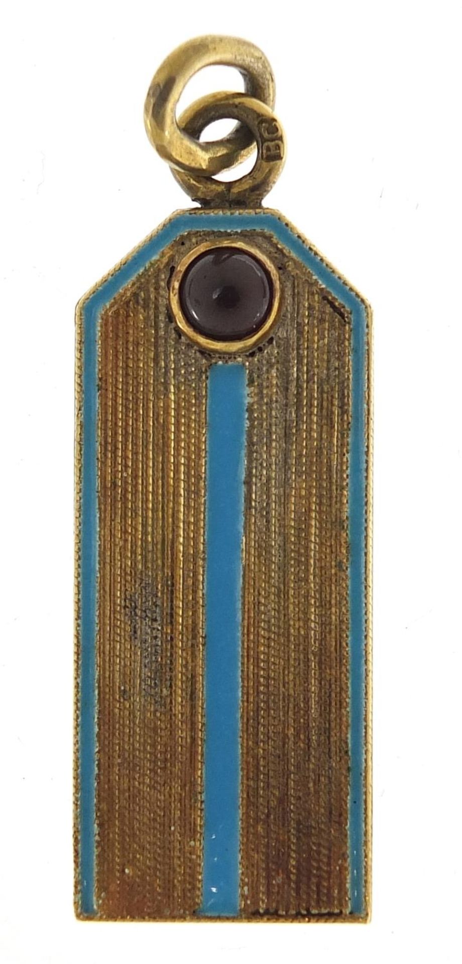 Silver gilt and enamel pendant set with a cabochon garnet, impressed Russian marks, 4cm high, 10.