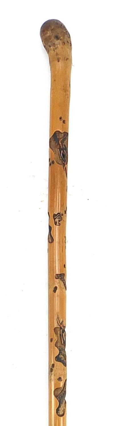 Good Chinese or Japanese bamboo walking stick finely carved with toads and serpents, 86cm in