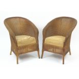 Pair of gold Lloyd Loom design tub chairs with drop in seats, 76cm high