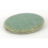 Antique white metal and shagreen mounted powder compact housed in a Chamois leather case, 9.5cm in