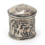 Antique silver cylindrical box with hinged lid embossed with mythical figures, indistinct marks to