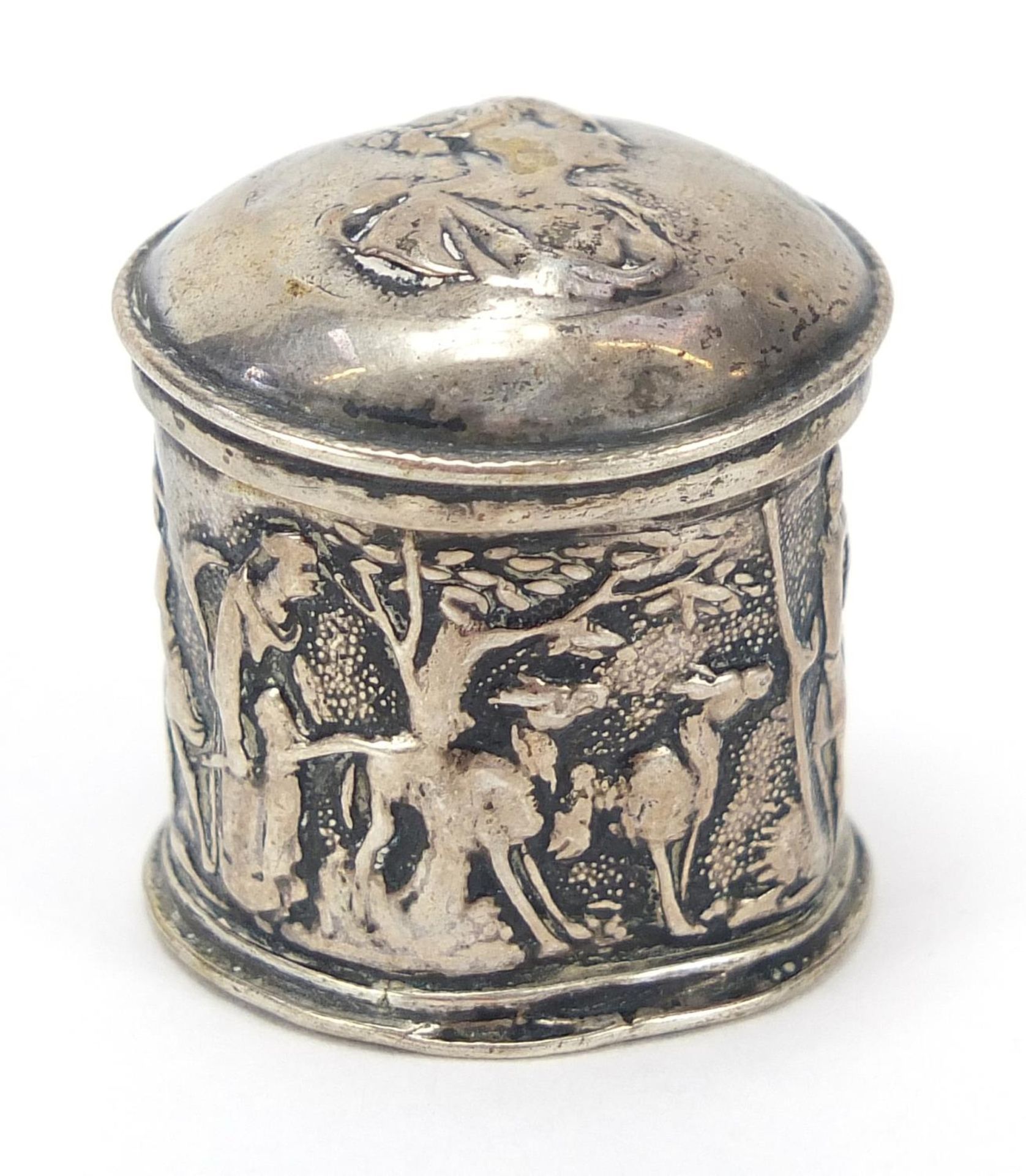 Antique silver cylindrical box with hinged lid embossed with mythical figures, indistinct marks to