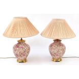 Pair of Chinese porcelain table lamps with shades each hand painted with flowers and plums, each