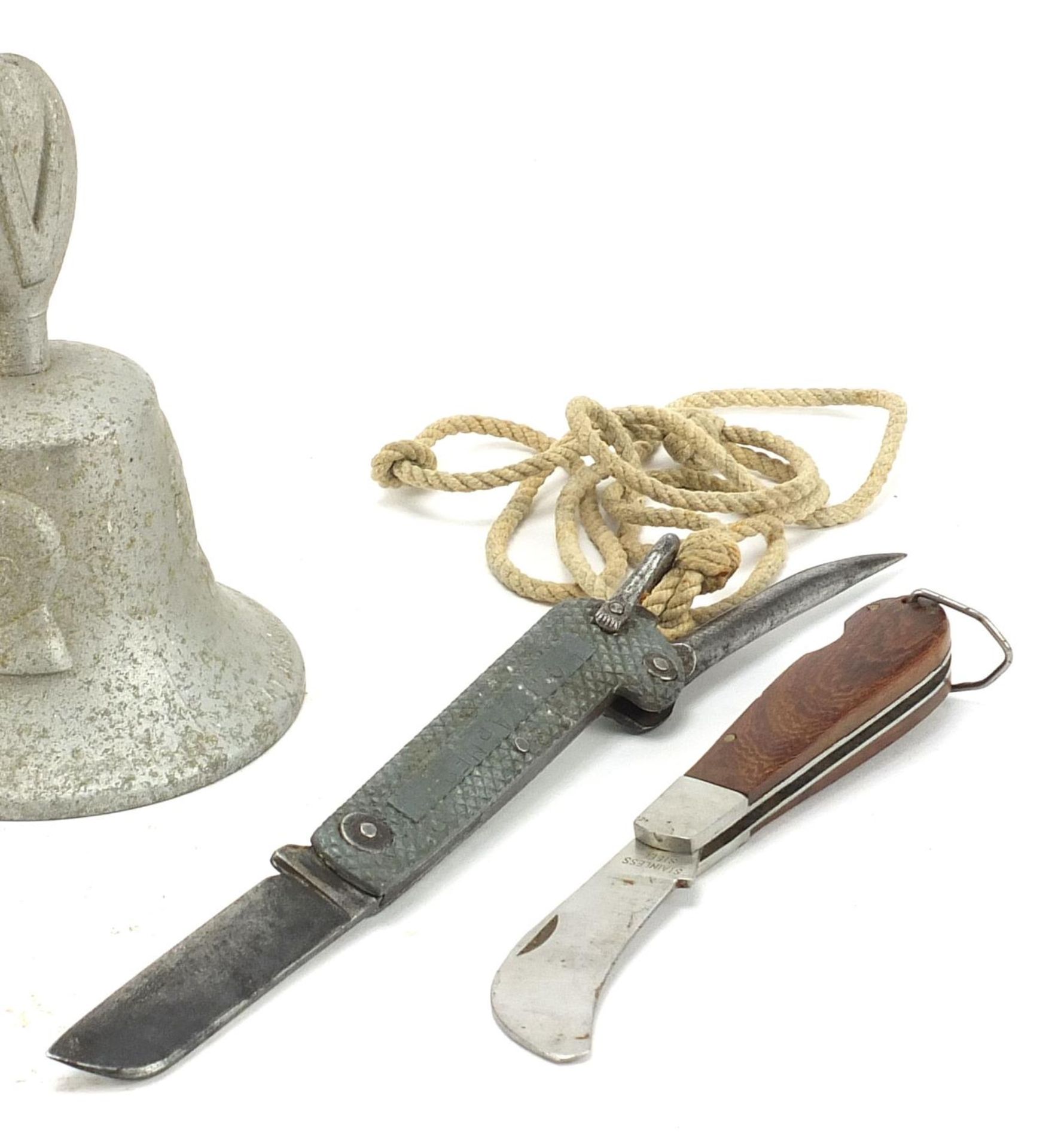 Militaria comprising a bell made from a German aircraft, folding pocket knife and a combat knife, - Image 3 of 5